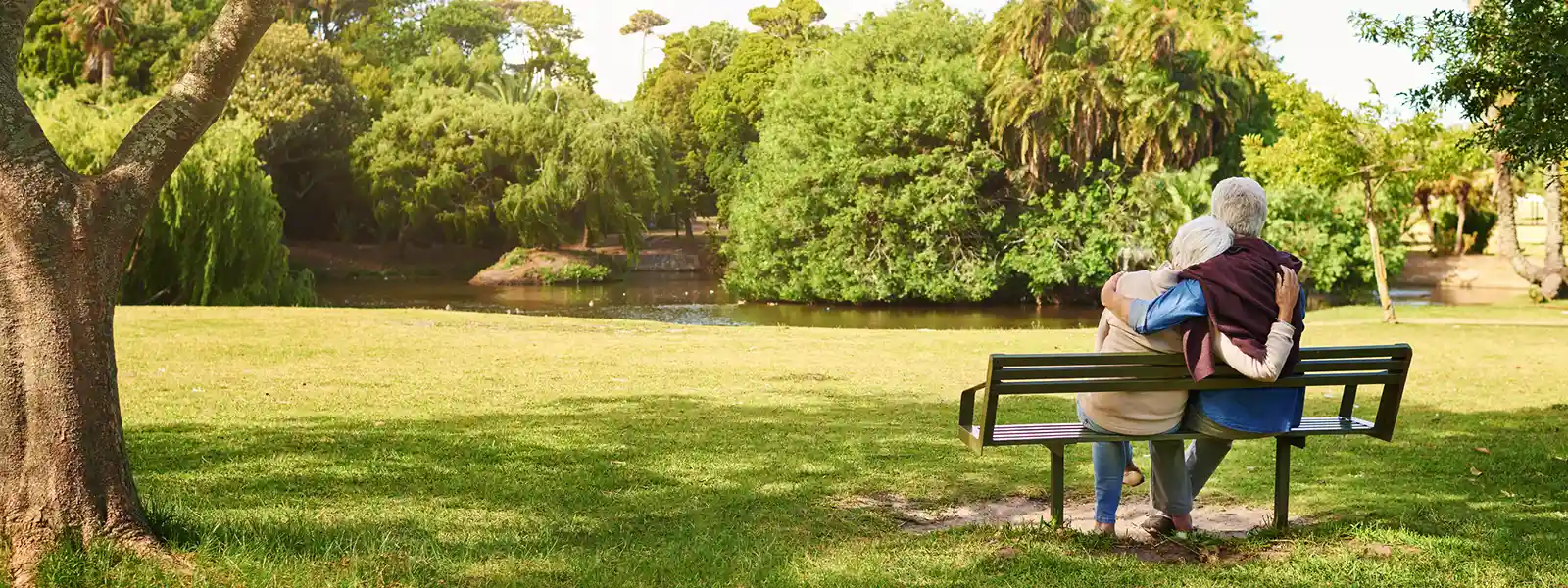 A couple sits on a bench